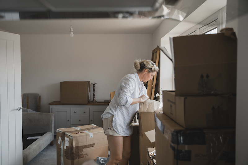 Unpacking Boxes In Her New Home