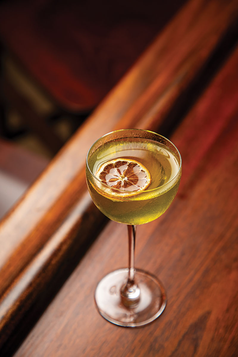 Drink with floating dried citrus slice.
