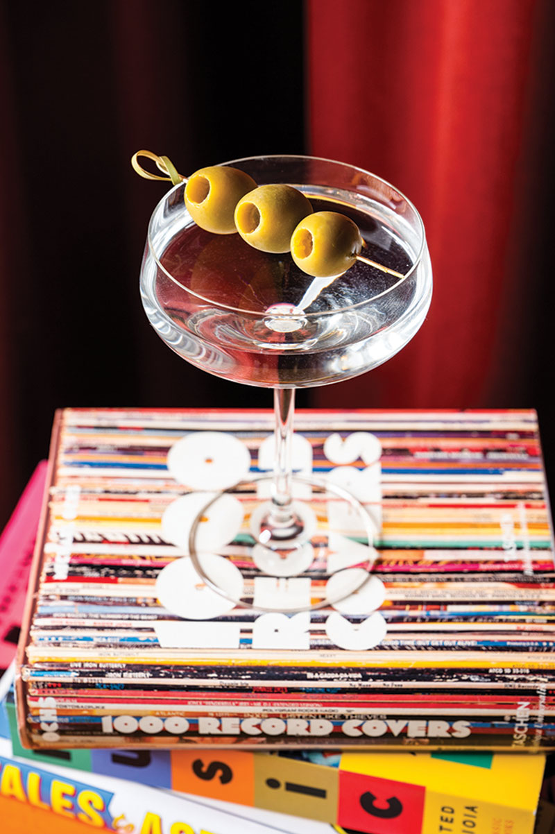 Drink with olives in glass.