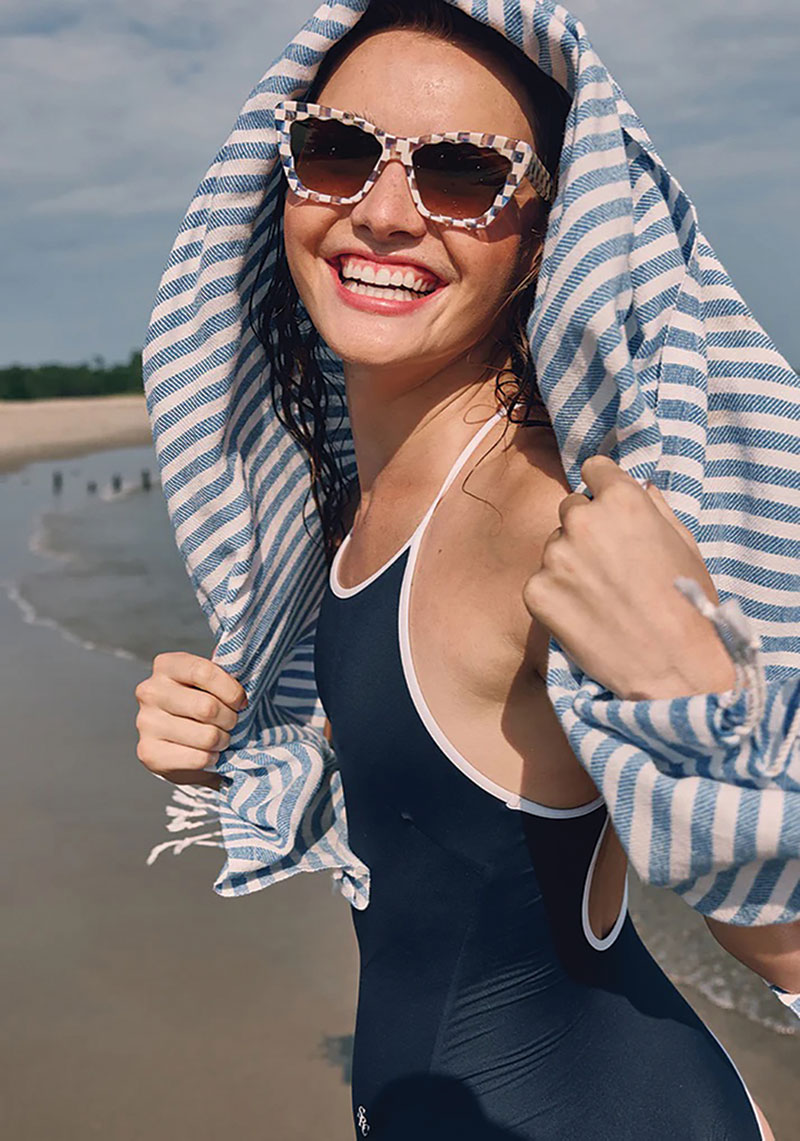 Woman wearing sunglasses, smiling