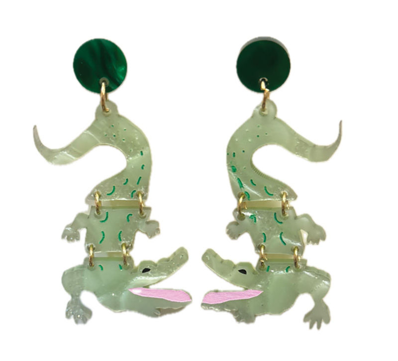 This segmented pair, shaped like alligators, made from lightweight acrylic with etching, inlay and hand-painted sections, subtly sways adding a bit of kinetic fun