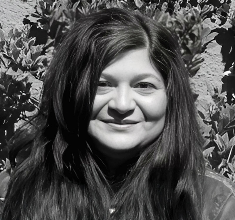 Black and white headshot of Gina Ferrara