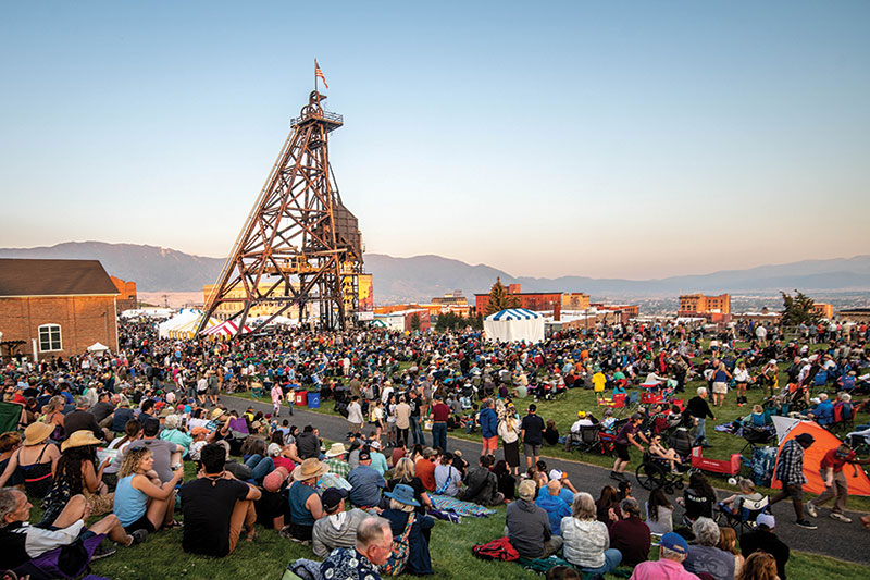 Mississippi A crowd of people sitting in the grass, enjoying live music