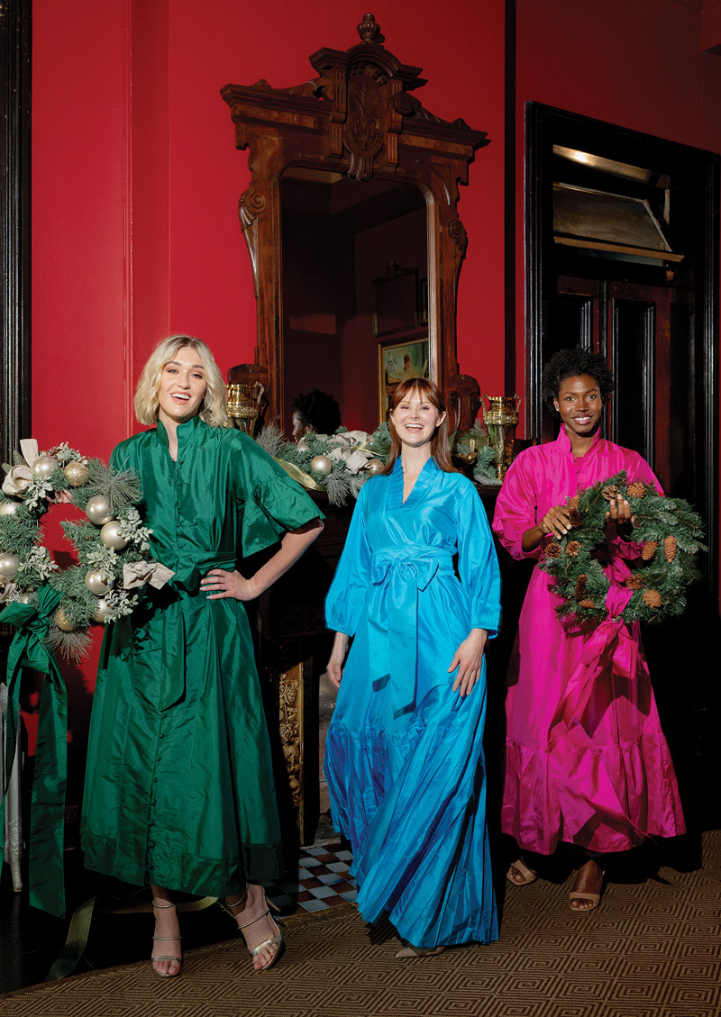 Jewel-Toned Clothing and Design Three women wearing flowy jewel-toned long dresses with long sleeves. From left to right –– emerald, turquoise, and magenta.