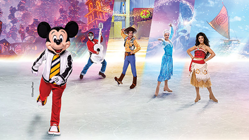 Mickey skating with other Disney characters on ice -- (Mickey far left, Miguel from Coco, Woody from Toy Story, Elsa from Frozen, and Moana)