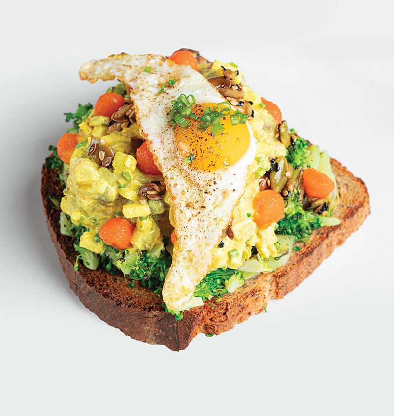 Applied Arts Café Brings Norway in The Bywater Avocado Toast - Poached egg, habanoda hot sauce, fried shallot, pea tendrils, country rye.
