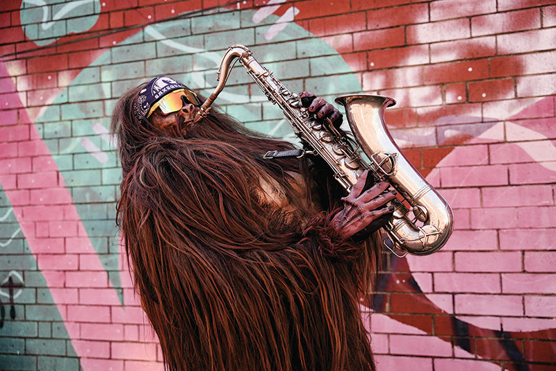 Saxsquatch playing the saxaphone